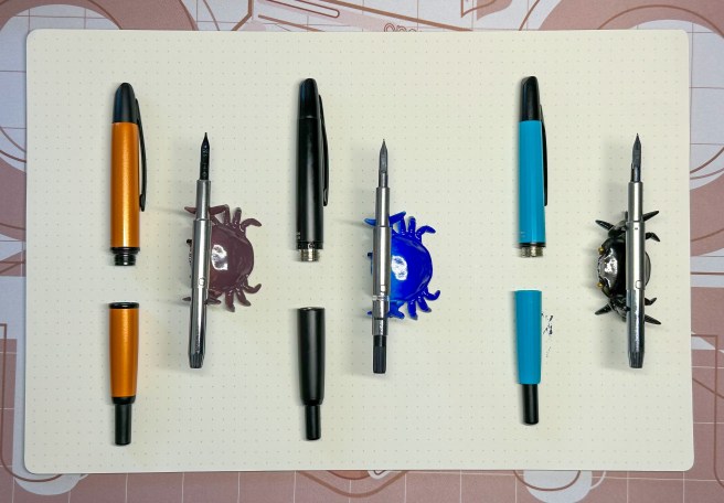 Pilot Vanishing Point, Majohn A1, and Majohn A2 lined up and disassembled.