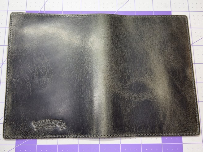 Galen Leather A6 cover in Crazy Horse Smokey on a 1 inch grid background