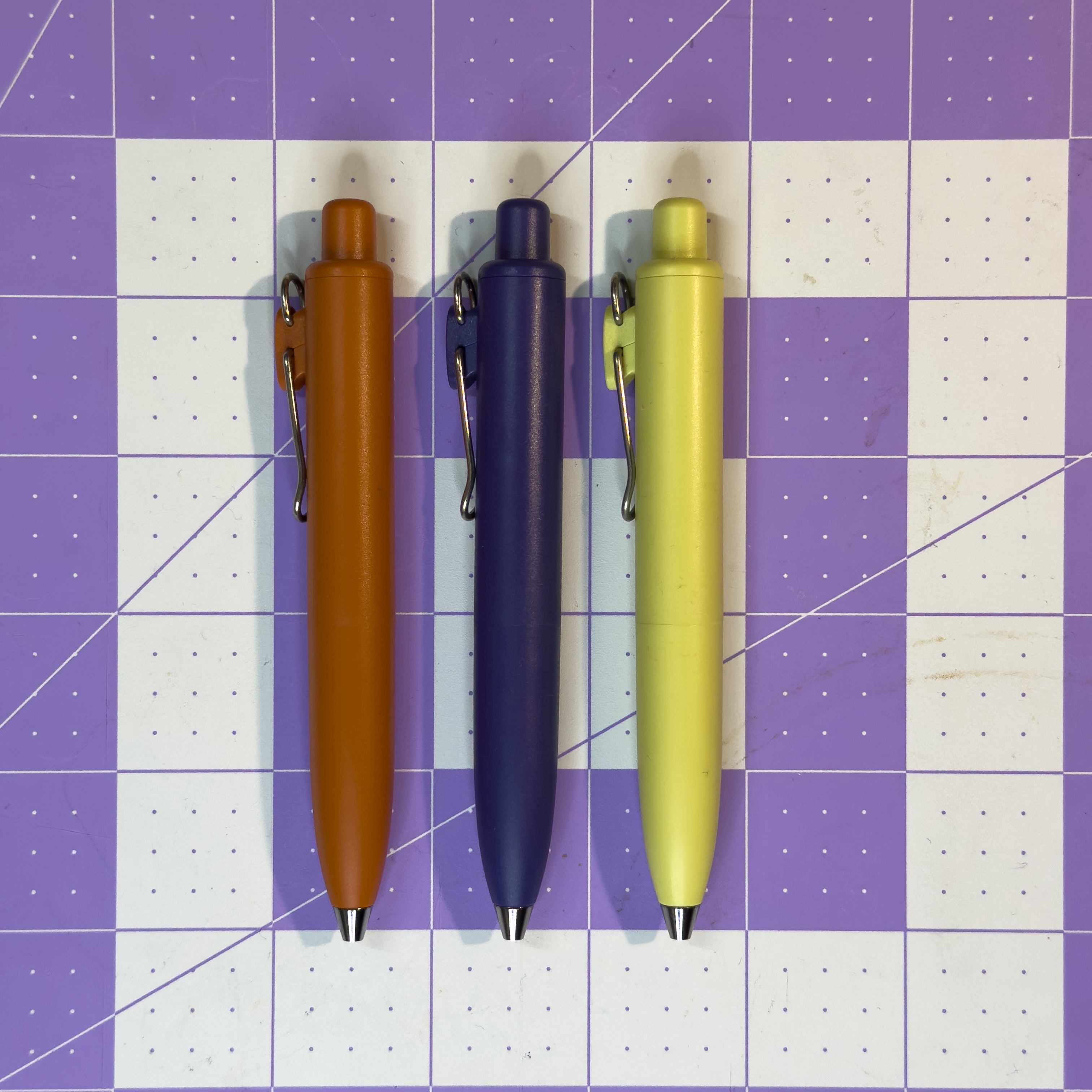 Uni-Ball One P pens in a lineup, showing multiple barrel colors