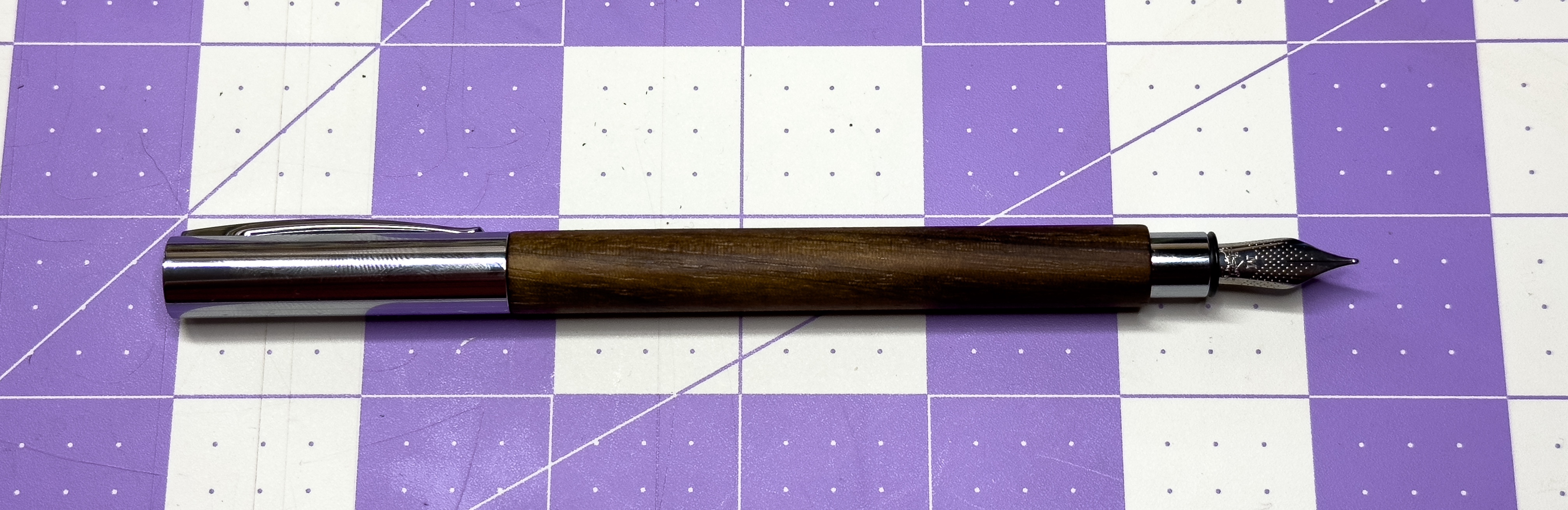 Faber-Castell Ambition walnut wood with the cap posted